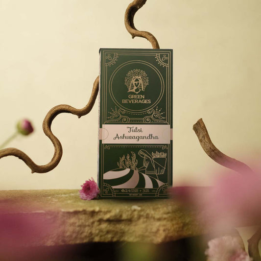 A packaging design for Ashwagandha Tulsi Green tea by Green Beverages. The box is green with gold details and depicts a woman harvesting crops.