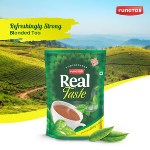 Promotional image of Rungta's Real Taste tea featuring a green package with a cup of tea, fresh tea leaves, and the text 'Refreshingly Strong Blended Tea' against a scenic background of a tea plantation.